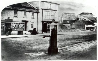 Christchurch High Street in 1859. Rubble can be seen where the Town Hall was removed